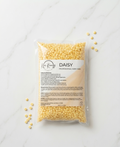 Kem Keeney Esthetics Packaged professional hard wax with 'Daisy' branding on a marble surface.