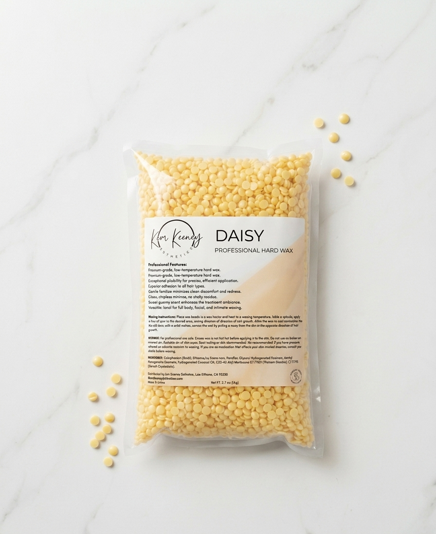 Kem Keeney Esthetics Packaged professional hard wax with 'Daisy' branding on a marble surface.