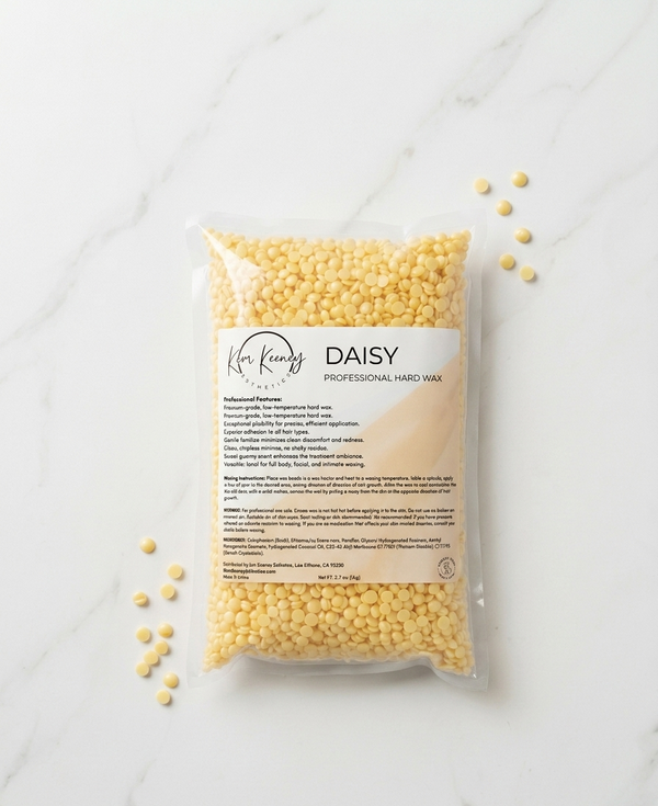Kem Keeney Esthetics Packaged professional hard wax with 'Daisy' branding on a marble surface.